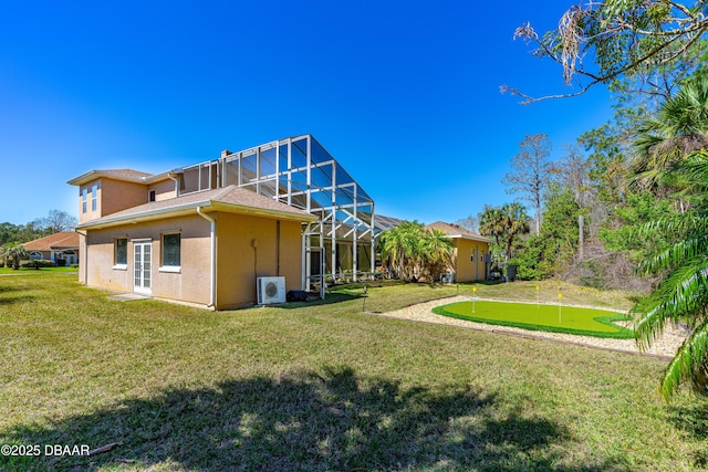 back of house featuring ac unit, a lawn, glass enclosure, and stucco siding