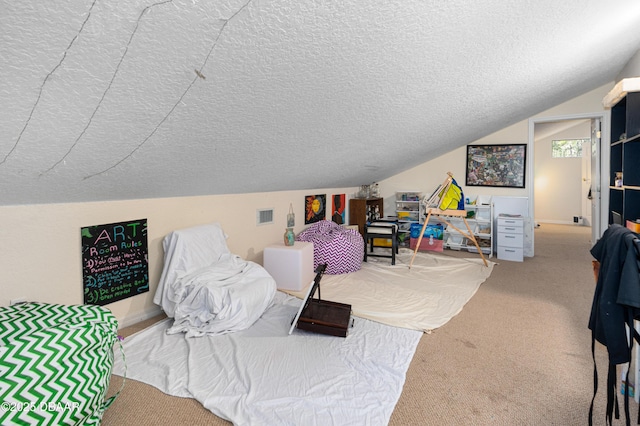 playroom featuring carpet, baseboards, visible vents, vaulted ceiling, and a textured ceiling