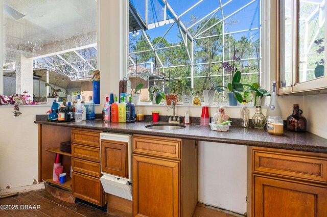 bar featuring indoor wet bar, a sunroom, and a sink