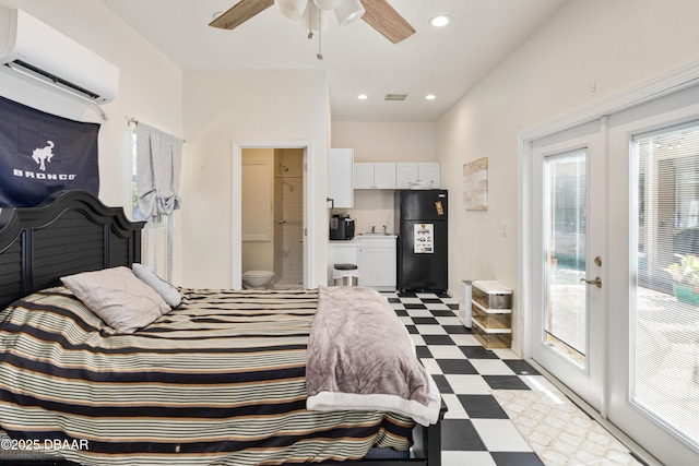 bedroom with access to exterior, dark floors, a wall mounted air conditioner, french doors, and freestanding refrigerator