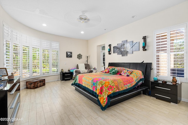 bedroom featuring recessed lighting, light wood-type flooring, baseboards, and ceiling fan