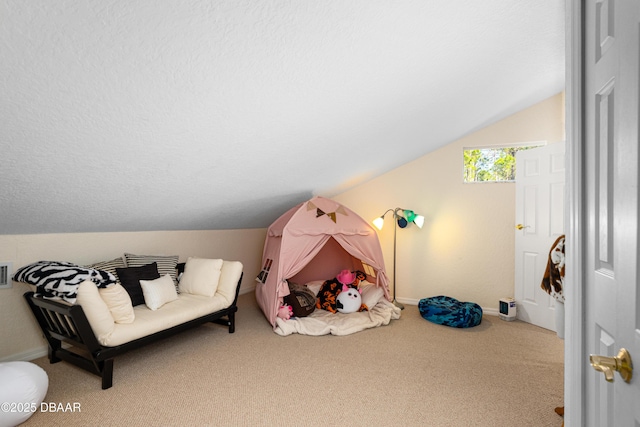 playroom featuring baseboards, carpet floors, a textured ceiling, and lofted ceiling