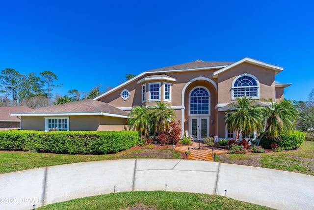 view of front of property with french doors and stucco siding