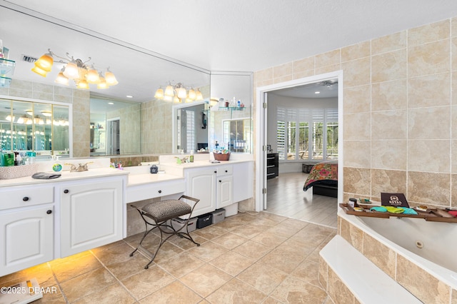 bathroom featuring tile walls, ensuite bathroom, and tile patterned flooring