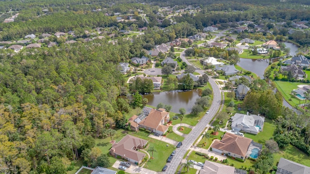 birds eye view of property with a residential view and a water view