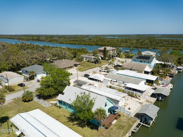 drone / aerial view featuring a residential view and a water view