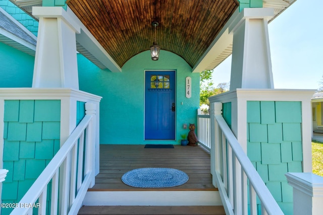 view of exterior entry featuring a porch