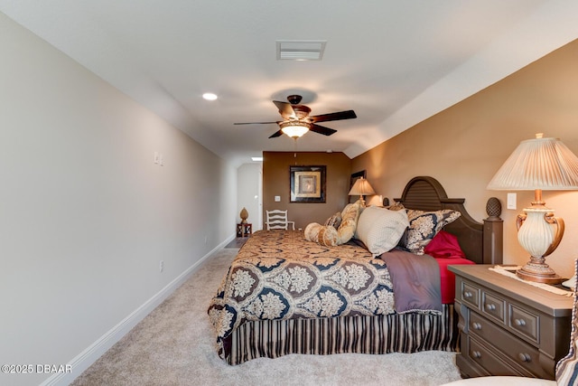 bedroom with ceiling fan, light colored carpet, visible vents, and baseboards