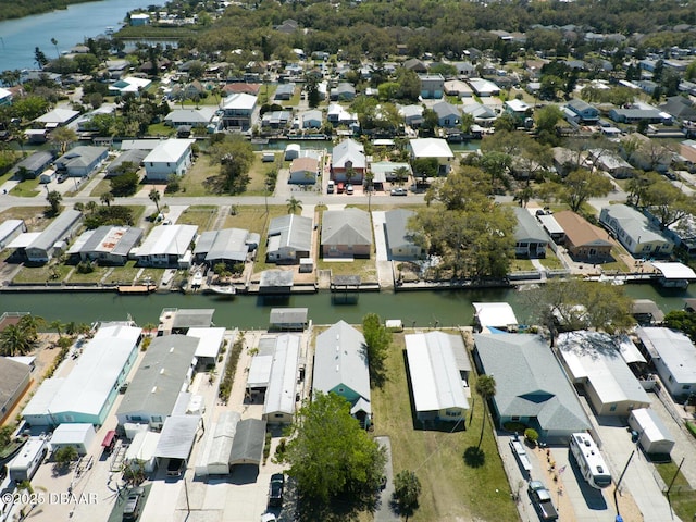 birds eye view of property featuring a residential view and a water view