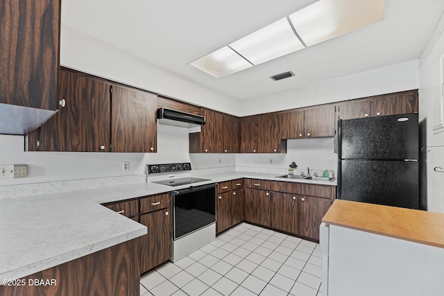 kitchen with dark brown cabinetry, white electric range, exhaust hood, and black fridge