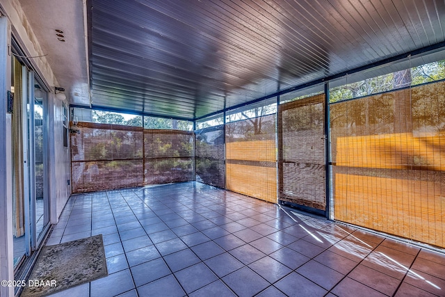 unfurnished sunroom featuring wood ceiling