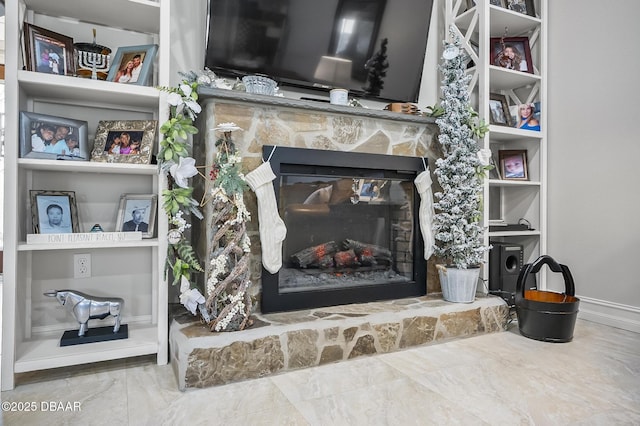 details with a stone fireplace