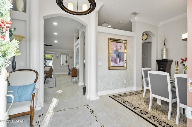 interior space with ornamental molding and decorative columns