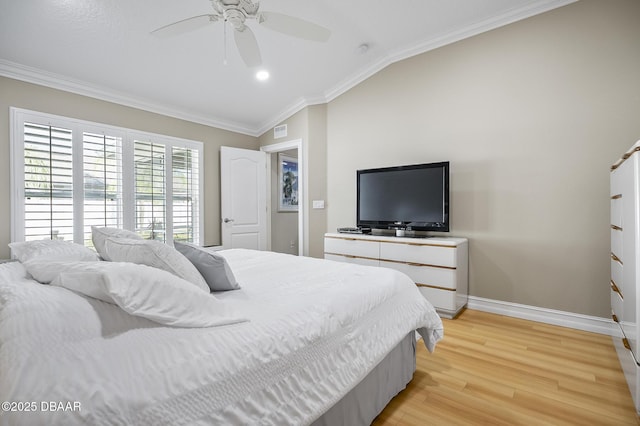 bedroom featuring ceiling fan, light wood-type flooring, vaulted ceiling, and ornamental molding