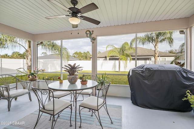 sunroom featuring ceiling fan