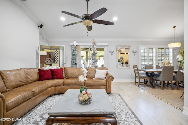 living room featuring light tile patterned floors, ceiling fan, and crown molding