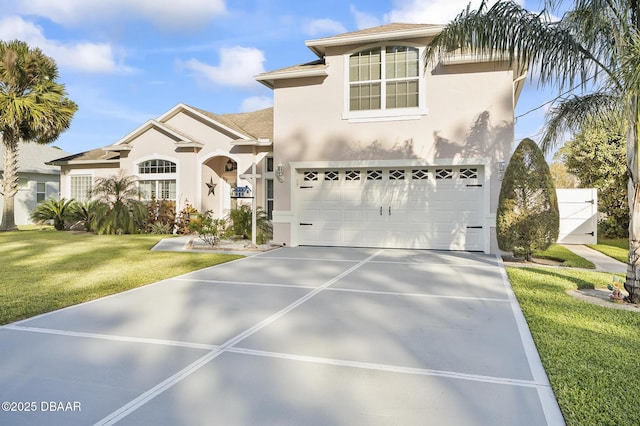 mediterranean / spanish-style house featuring a front lawn and a garage