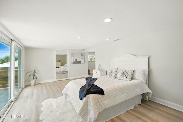 5540 W Bayshore Dr, Port Orange, FL 32127 - bedroom featuring light wood finished floors, access to outside, and recessed lighting