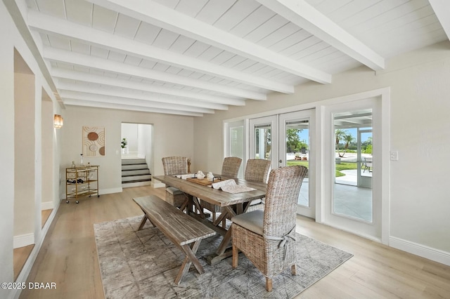 5540 W Bayshore Dr, Port Orange, FL 32127 - dining space with french doors, light wood-style flooring, a wood ceiling with exposed beams, and stairs