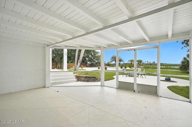 5540 W Bayshore Dr, Port Orange, FL 32127 - unfurnished sunroom with plenty of natural light and beamed ceiling