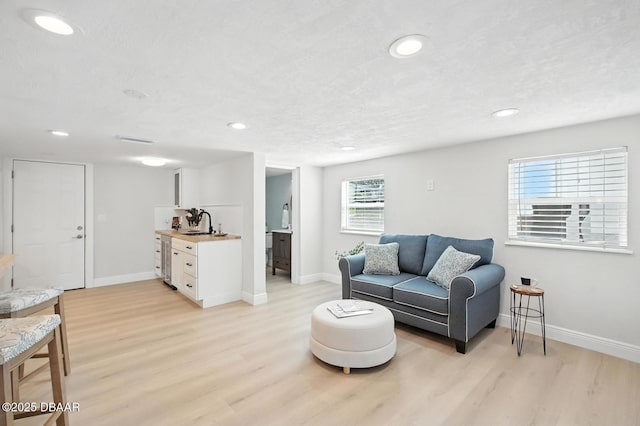 5540 W Bayshore Dr, Port Orange, FL 32127 - living area featuring light wood finished floors and recessed lighting