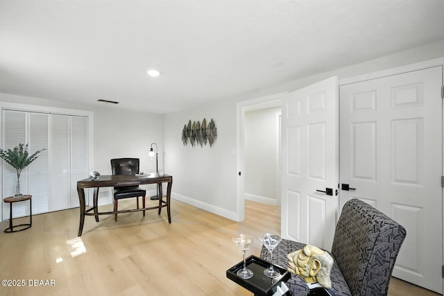 5540 W Bayshore Dr, Port Orange, FL 32127 - home office featuring light wood-style flooring and baseboards