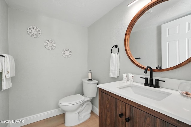 5540 W Bayshore Dr, Port Orange, FL 32127 - half bath featuring wood finished floors and vanity