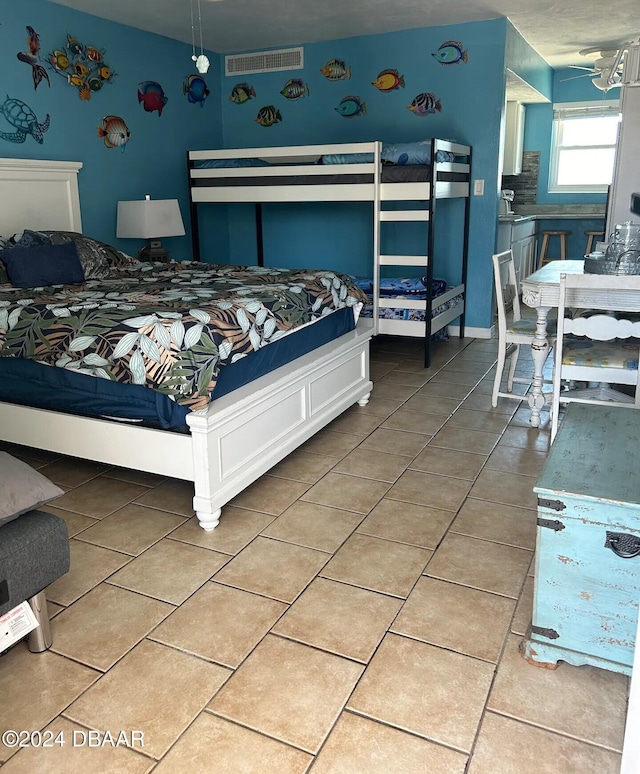 bedroom featuring light tile patterned floors and visible vents