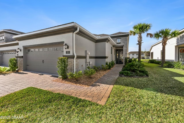 view of front of house with a garage and a front yard