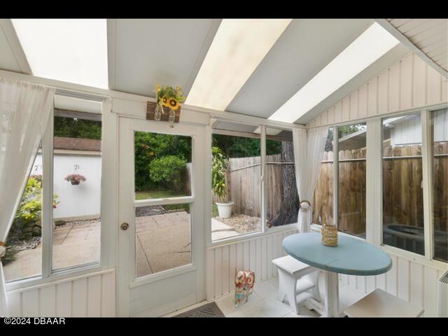 sunroom / solarium with lofted ceiling