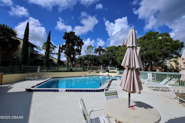 219 Club House Blvd Unit 219, New Smyrna Beach, FL 32168 - community pool featuring a patio and fence