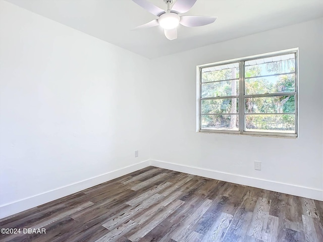 unfurnished room featuring ceiling fan and dark hardwood / wood-style floors