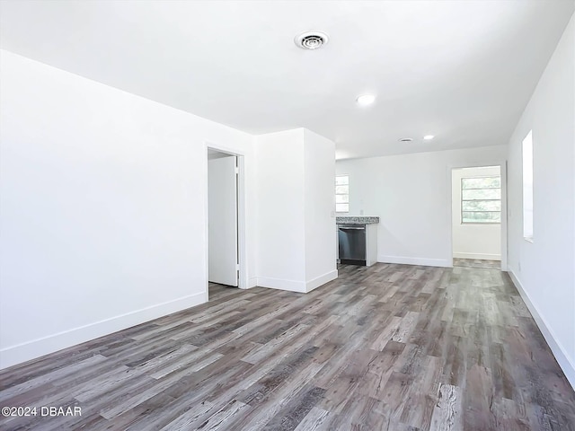 unfurnished living room featuring wood-type flooring