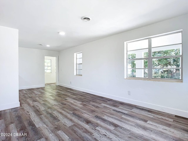 empty room featuring dark wood-type flooring