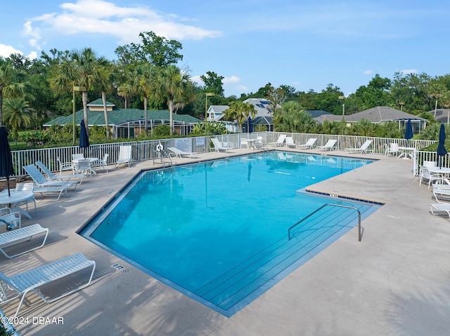 view of swimming pool with a patio area