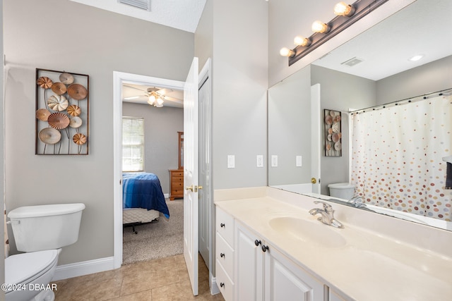 bathroom with tile patterned floors, vanity, a textured ceiling, toilet, and ceiling fan