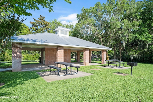 view of community with a yard