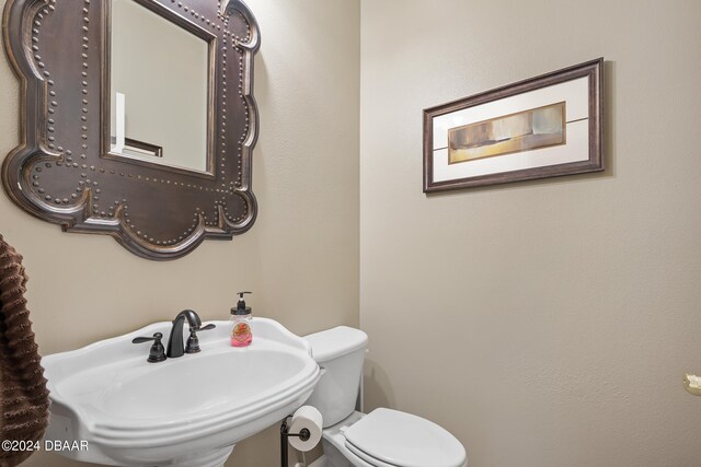 bathroom with toilet and sink