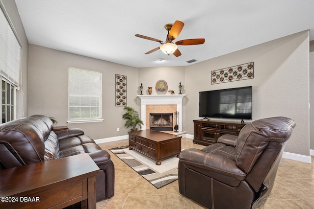 tiled living room with ceiling fan