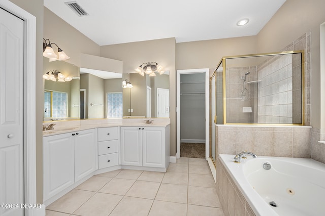 bathroom featuring vanity, tile patterned flooring, and plus walk in shower