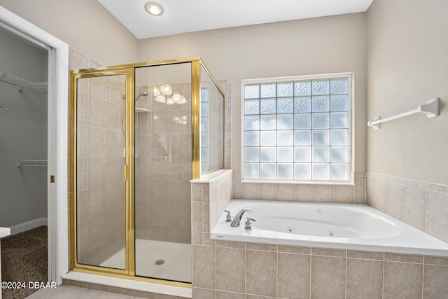 bathroom with tile patterned floors and separate shower and tub