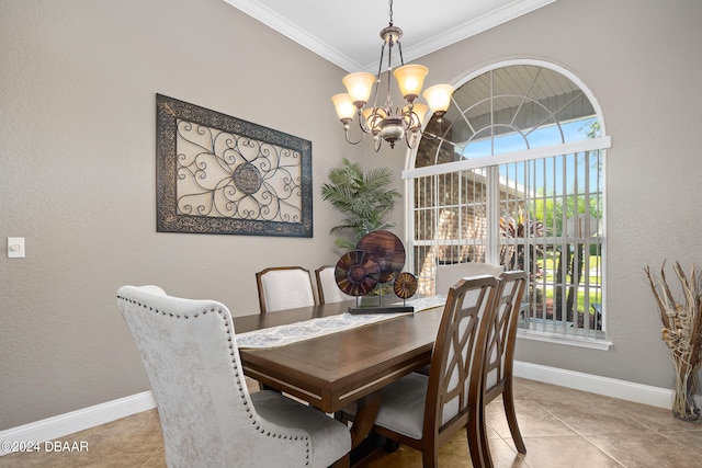 tiled dining room with a chandelier and crown molding