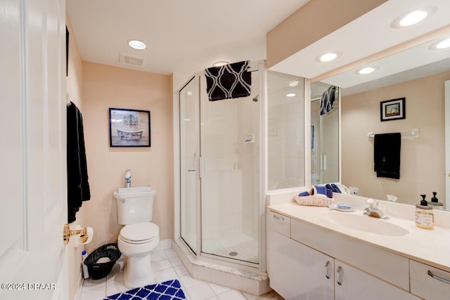 bathroom featuring tile patterned floors, vanity, toilet, and an enclosed shower