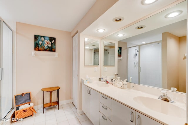 bathroom featuring vanity, tile patterned floors, and a shower with shower door