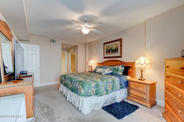 bedroom featuring ceiling fan and light colored carpet