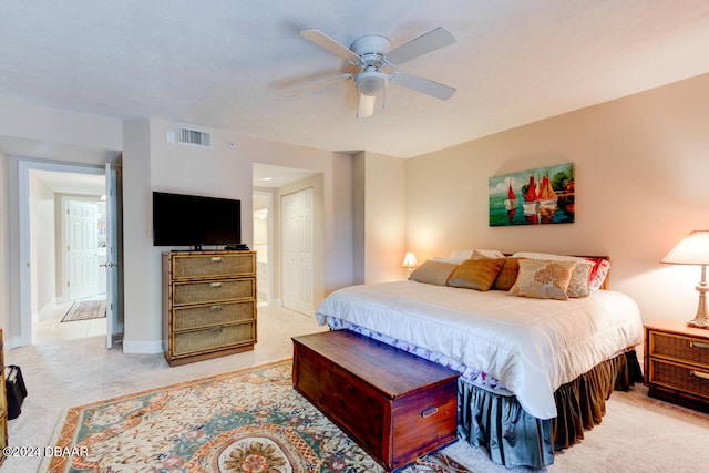 carpeted bedroom featuring ceiling fan