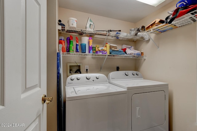 washroom featuring washer and clothes dryer