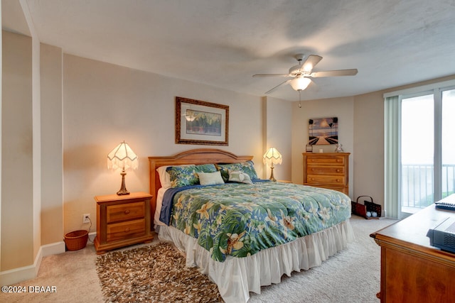 bedroom with carpet flooring, access to outside, and ceiling fan