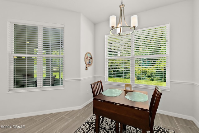 dining space featuring a notable chandelier