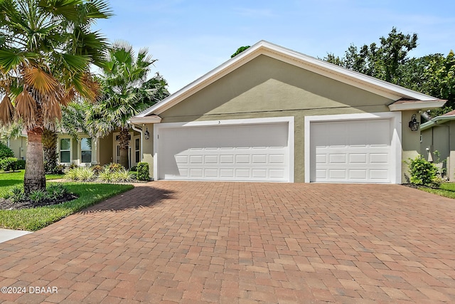 ranch-style home with a garage